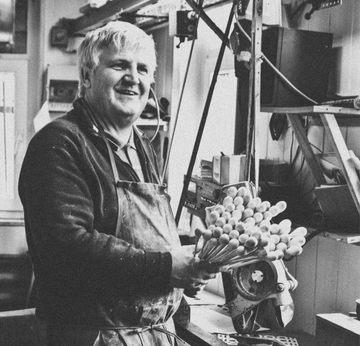 Master wood turner Matthias Hellinger holding freshly turned baton handles