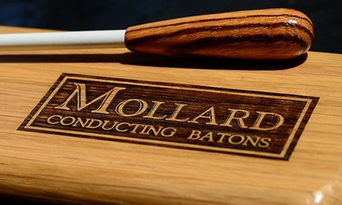 Mollard baton with a zebrawood handle resting on an engraved Mollard hardwood case